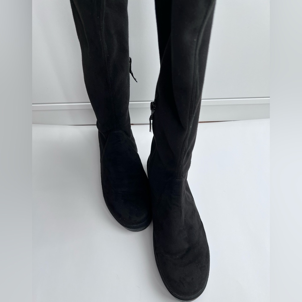 Black over the knee boots by Stuart Weitzman. Style name is Lowland